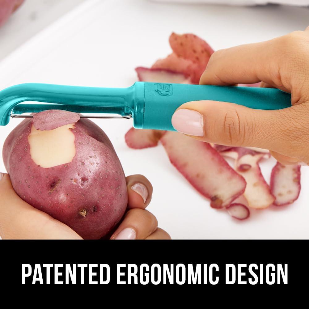 imageGORILLA GRIP Patented BPAFree Sharp Stainless Steel Dual Swivel Vegetable Peeler Soft Comfortable Handle Smoothly Peel Apples Potatoes Carrots Includes Blade Cover Holiday Prep Essentials BlackTurquoise